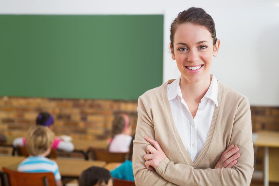 bigstock-pretty-teacher-smiling-at-came-69887626_orig.jpg