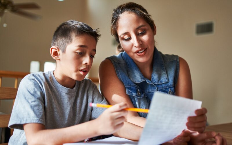 mother helping son with homework